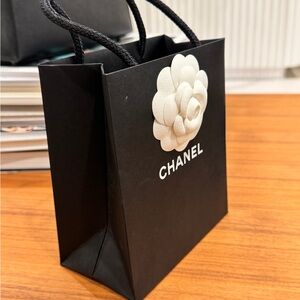 Small Chanel shopping bag with white camellia and ribbon